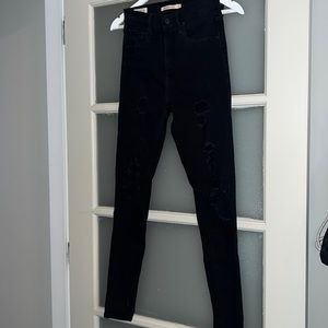 Black super high rise ripped skinny jeans from Levi’s